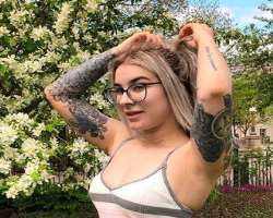 She uses glasses to see clearly.